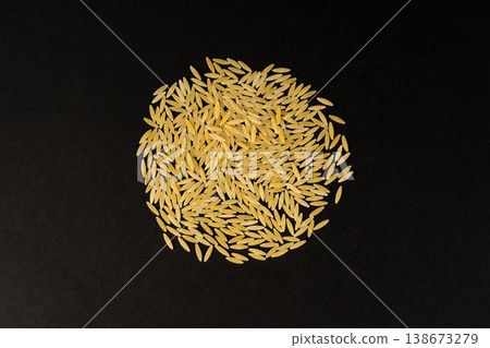 Raw orzo pasta, risoni or kritharaki pile 138673279