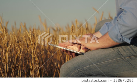 wheat farmer tablet agriculture sunset 138673295