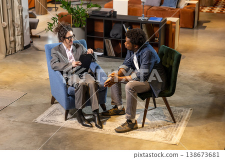 Woman talking to man in stylish office Woman talking to man in stylish office 138673681