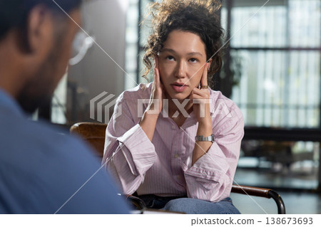 Woman client looking up thinking during session Woman client looking up thinking during session 138673693