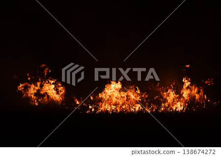 Burning fire flames isolated on dark background with smoke, dramatic wildfire effect, high contrast fire texture for overlay and design use. Burning fire flames isolated on dark background with smoke, dramatic wildfire effect, high contrast fire texture for overlay and design use. 138674272