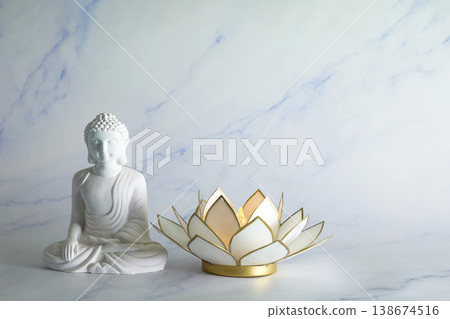 Vesak Buddha birthday. White buddha statue and lotus candle holder Vesak Buddha birthday. White buddha statue and lotus candle holder 138674516
