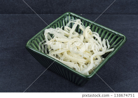 Asian Dried Squid Strips, Traditional Seafood Snack. Asian Dried Squid Strips, Traditional Seafood Snack. 138674751