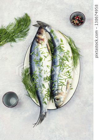 Whole Salted Herring Fish with Dill on Ceramic Plate Whole Salted Herring Fish with Dill on Ceramic Plate 138674958