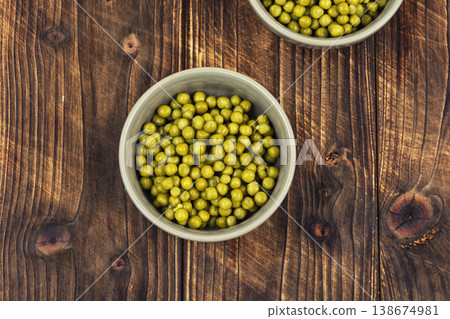 Green peas in bowl on table Green peas in bowl on table 138674981