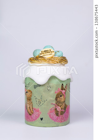 Easter Kulich with White Glaze and Nest of Eggs in Green Bunny Box Easter Kulich with White Glaze and Nest of Eggs in Green Bunny Box 138675443