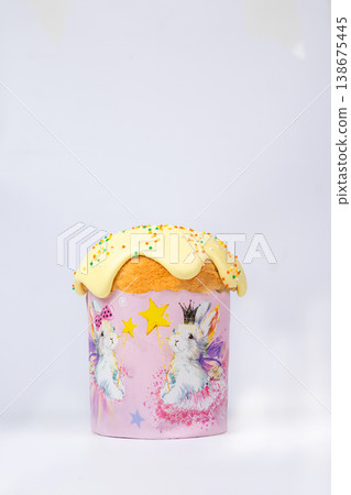 Easter Kulich with Yellow Glaze and Colorful Sprinkles in Pink Bunny Box Easter Kulich with Yellow Glaze and Colorful Sprinkles in Pink Bunny Box 138675445