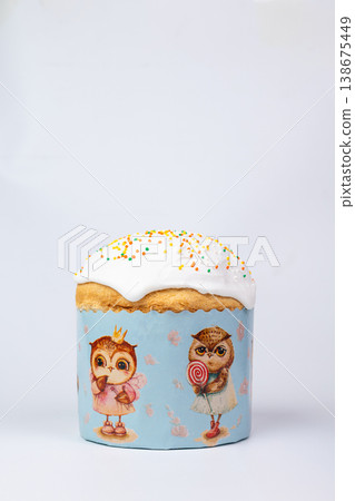 Easter Kulich with White Glaze and Multicolored Sprinkles in Owl Box Easter Kulich with White Glaze and Multicolored Sprinkles in Owl Box 138675449