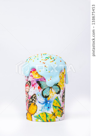 Easter Kulich with Light Blue Glaze and Colorful Sprinkles in Butterfly Box Easter Kulich with Light Blue Glaze and Colorful Sprinkles in Butterfly Box 138675453