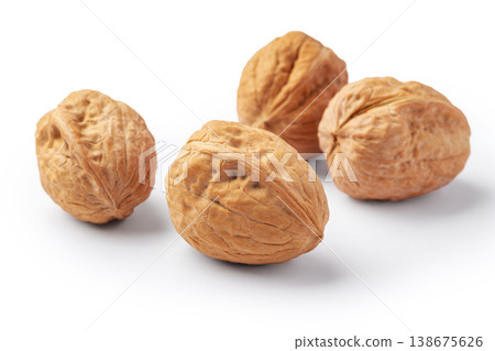 Walnuts with shell isolated on white background, closeup Walnuts with shell isolated on white background, closeup 138675626