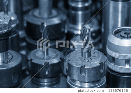 Close-up of a high-performance wave edge rough cutter installed in a tool holder for heavy-duty CNC milling. Close-up of a high-performance wave edge rough cutter installed in a tool holder for heavy-duty CNC milling. 138676136