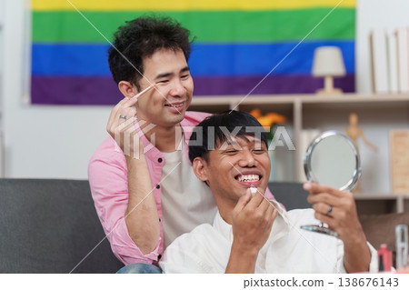 LGBTQIA couple enjoying makeup session at home LGBTQIA couple enjoying makeup session at home 138676143
