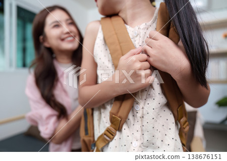 Mother assisting daughter with back-to-school preparation Mother assisting daughter with back-to-school preparation 138676151