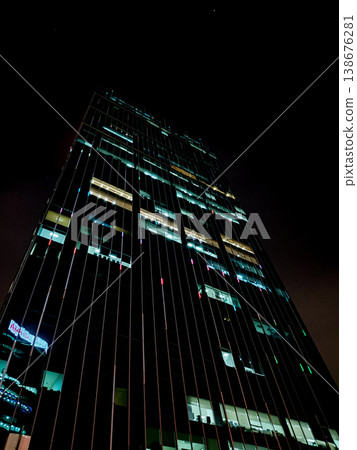 Illuminated Modern Skyscraper Night Low Angle Illuminated Modern Skyscraper Night Low Angle 138676281