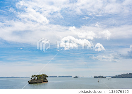 Matsushima Bay in spring: A breathtaking view of islands covered in pine trees. Miyagi Prefecture. One of Japan's three most scenic spots. Matsushima Bay in spring: A breathtaking view of islands covered in pine trees. Miyagi Prefecture. One of Japan's three most scenic spots. 138676535