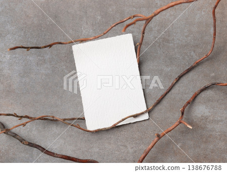 Blank card mockup on grey stone with dry branches, copy space. Minimal rustic stationery template 138676788