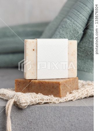 Handmade solid soap bars with blank label mockup on soap saver bag near sage green towel Handmade solid soap bars with blank label mockup on soap saver bag near sage green towel 138676804
