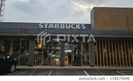 this is Starbucks store and logo this is Starbucks store and logo 138676996