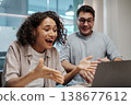 Woman Reacts Happily To Surprise. Woman Shows Excitement With Animated Gestures During Online Discovery 138677612