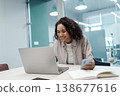 Relaxed Female Professional Balancing Schedule And Priorities Using Electronic Devices And Printed Planner 138677616