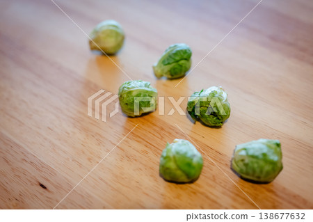 Brussels sprouts placed on a wooden table Brussels sprouts placed on a wooden table 138677632