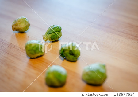 Brussels sprouts placed on a wooden table Brussels sprouts placed on a wooden table 138677634