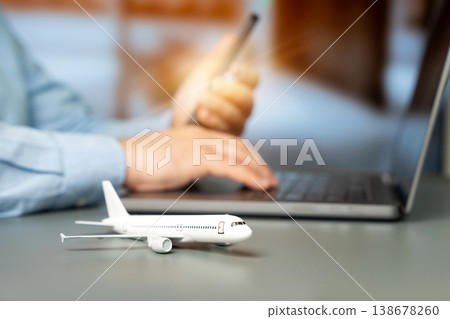 Airplane and businessman using a laptop 138678260