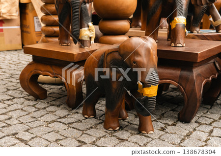 Wooden elephant carving at festival market stall in Berlin 138678304