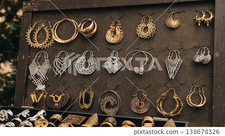 Decorative earrings displayed at festival market stall in Berlin 138678326