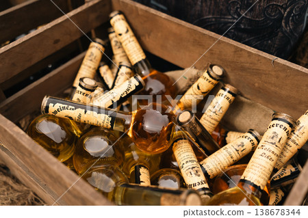 Glass bottles in wooden crate at festival market stall in Berlin 138678344