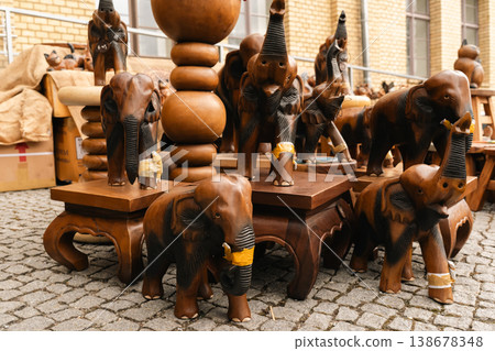 Wooden elephant carvings displayed at market stall in Berlin 138678348