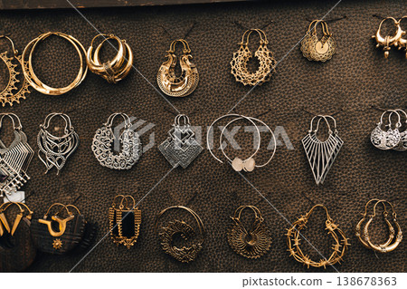 Decorative earrings displayed at festival market stall in Berlin 138678363