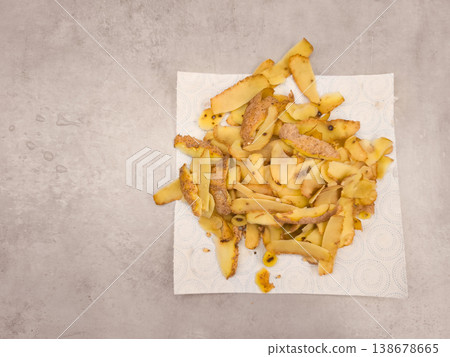 Potato peels drying on absorbent paper towel after peeling, copy space 138678665