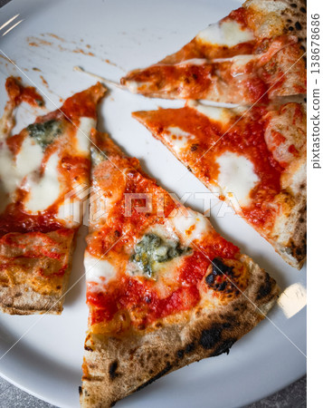 Delicious slices of pizza topped with cheese and sauce on a plate showcasing culinary delight concept. copy space 138678686