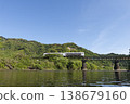 The Umisachi Yamasachi train on the Nichinan Line is traveling across the Hirotogawa Railway Bridge in Fukamidori, Kitago-cho, Nichinan City, Miyazaki Prefecture. 138679160