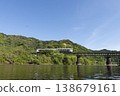 The Umisachi Yamasachi train on the Nichinan Line is traveling across the Hirotogawa Railway Bridge in Fukamidori, Kitago-cho, Nichinan City, Miyazaki Prefecture. 138679161