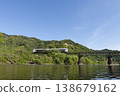 The Umisachi Yamasachi train on the Nichinan Line is traveling across the Hirotogawa Railway Bridge in Fukamidori, Kitago-cho, Nichinan City, Miyazaki Prefecture. 138679162
