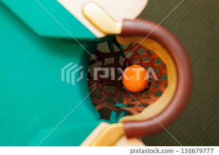 Billiard accessories balls and cue on a billiard table 138679777