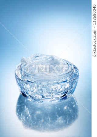 Skincare gel cream in crystal jar on reflective surface, showing freshness and hydration for beauty products 138680040