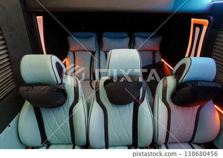 Luxury Passenger Seating Interior with Light Blue Leather and Modern Ambient Orange Lighting Luxury Passenger Seating Interior with Light Blue Leather and Modern Ambient Orange Lighting 138680456