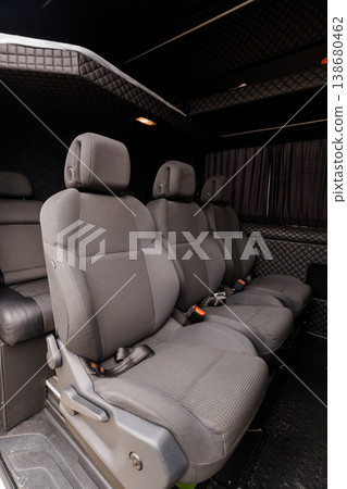 Interior of Luxury Passenger Van with Grey Fabric Seats and Diamond Quilted Ceiling Lining Interior of Luxury Passenger Van with Grey Fabric Seats and Diamond Quilted Ceiling Lining 138680462