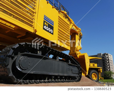 Large dump trucks and excavators used in mines and large-scale construction sites Large dump trucks and excavators used in mines and large-scale construction sites 138680523