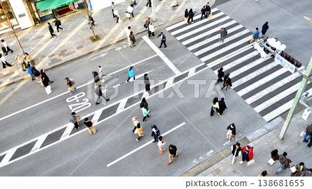 People walking in the pedestrian zone of Ginza Street on the weekend. People walking in the pedestrian zone of Ginza Street on the weekend. 138681655