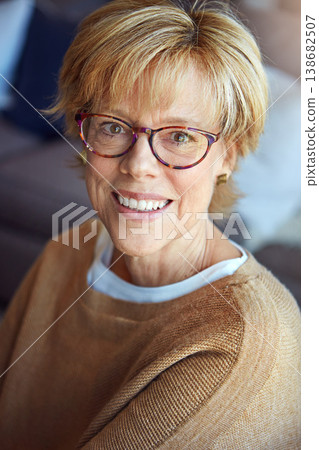 Mature, relax or portrait of happy woman in glasses in house living room with freedom, pride for resting break. Apartment, face or senior person with smile or wellness in retirement, lounge or home Mature, relax or portrait of happy woman in glasses in house living room with freedom, pride for resting break. Apartment, face or senior person with smile or wellness in retirement, lounge or home 138682507