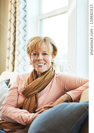 Portrait, smile or senior woman in living room to relax with joy on couch or sofa at home. Apartment, calm or happy mature person with peace or wellness in retirement, lounge or house for resting Portrait, smile or senior woman in living room to relax with joy on couch or sofa at home. Apartment, calm or happy mature person with peace or wellness in retirement, lounge or house for resting 138682813