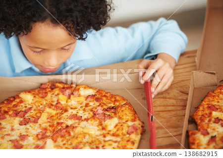 Child, boy and pizza takeaway box for hungry snack, junk fast food dinner at kitchen table. Male person, kid and hawaiian pineapple bacon meal or joy reward eating or unhealthy diet, carbs for lunch Child, boy and pizza takeaway box for hungry snack, junk fast food dinner at kitchen table. Male person, kid and hawaiian pineapple bacon meal or joy reward eating or unhealthy diet, carbs for lunch 138682915