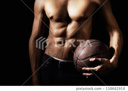 Muscle, body and hands of man with basketball in studio isolated on a black background. Sports, closeup and strong athlete with ball, sexy abs and workout for fitness, training or exercise for health Muscle, body and hands of man with basketball in studio isolated on a black background. Sports, closeup and strong athlete with ball, sexy abs and workout for fitness, training or exercise for health 138682918