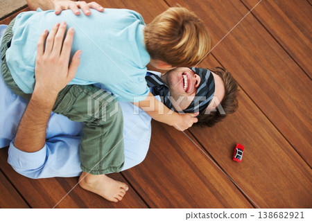 Man, blindfold and playing with child in living room, happy and family home with support of businessman with kid. Man, boy and quality time together with trust in fantasy, game and care on floor Man, blindfold and playing with child in living room, happy and family home with support of businessman with kid. Man, boy and quality time together with trust in fantasy, game and care on floor 138682921