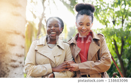 Business women, friends and street with laugh, conversation and walking together in park, sunshine or holding hands. African employees, outdoor and happy by trees for comic gossip, funny joke or chat 138683096