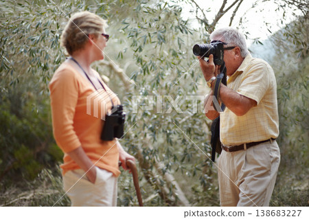 Senior, couple and camera in forest for picture, memory or photography on adventure and travel experience. Elderly, man and woman with photograph in woods for love, retirement and happiness in nature Senior, couple and camera in forest for picture, memory or photography on adventure and travel experience. Elderly, man and woman with photograph in woods for love, retirement and happiness in nature 138683227